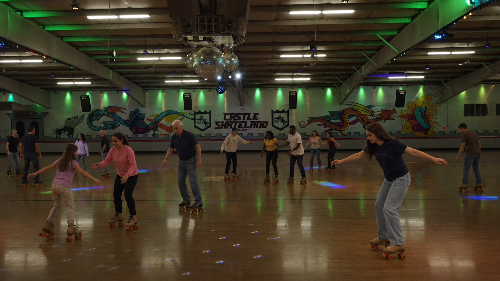 Skaters learning together on the Castle Skateland floor